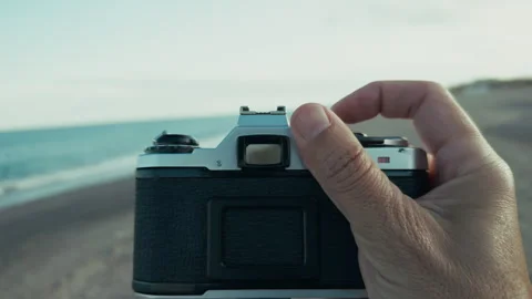 Hands Of A Man Changing The Settings Of The Old Camera Stock Footage 310692375