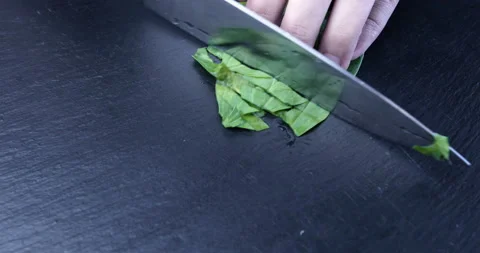 Hands of man chopping spinach Stock Footage 118762341