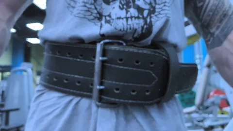 Hands of man clapping magnesia in slow motion.  Preparing to lift barbell Stock-Footage 117937996