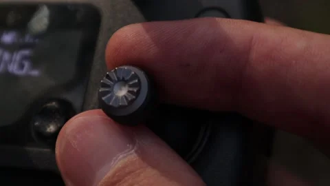 Hands of a man control the remote control from an unmanned aerial vehicle. Stock Footage 134336500