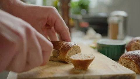 Hands of Man Cutting Bread Stock Footage 249829031