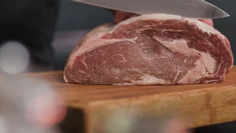 Hands man cutting fresh meat raw lunch condiment preparation beef board cooking Stock Footage 103286417