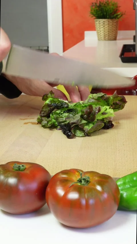 Hands of a man cutting lettuce Stock Footage 278921793