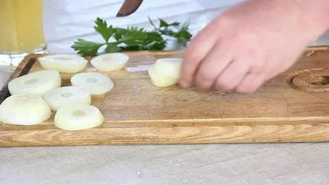 Hands of a man cutting an onion Stock Footage 84138687