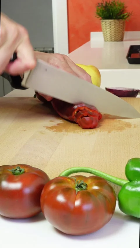 Hands of a man cutting a red pepper Stock Footage 278921249