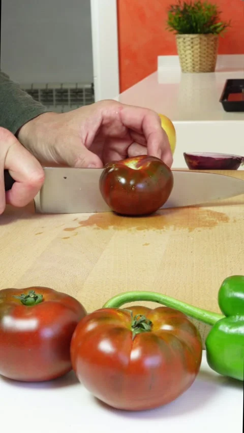 Hands of a man cutting a tomato Stock Footage 278921512
