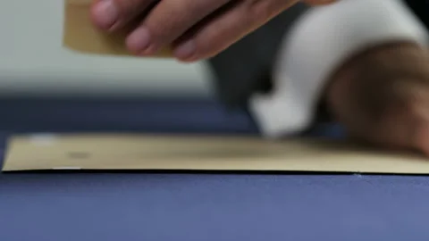 Hands of a Man Drawing a White Line on a Blue Material Stock Footage 90084657