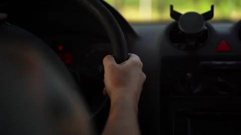 Hands of a man driving a car Stock Footage 324755679
