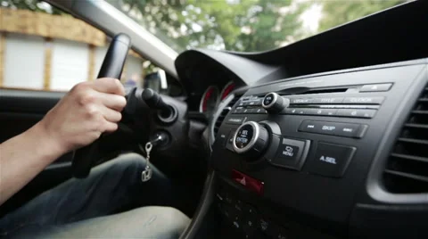 Hands of a man driving a car in slow motion Stock Footage 65798037