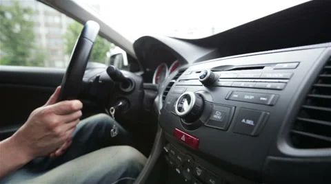 Hands of a man driving a car in slow motion Stock Footage 65823151