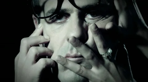 Hands on a man face Stock Footage 11061776