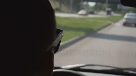 Hands of a man, a guy, a young man on the steering wheel of a car Stock Footage 109607410
