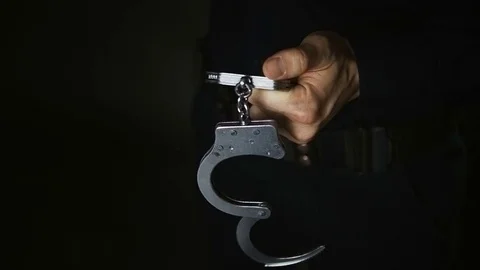 In The Hands of a Man Handcuffed. Night Stock Footage 73035847