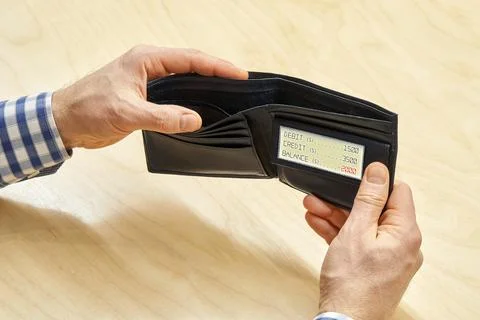 Hands of man hold empty black wallet with electronic screen Stock Photos