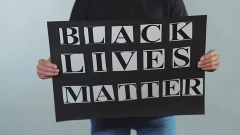 Hands man hold poster Black Lives Matter racial morality society peace human Video stock 133637325