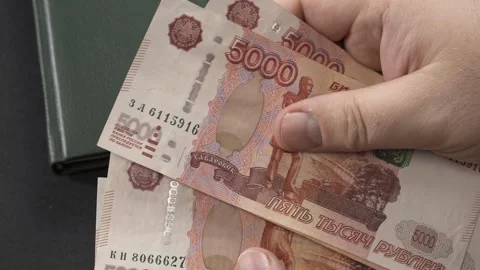Hands of a man holding and counting banknotes of Russian rubles Stock Footage 259044526