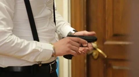 Hands Of The Man Holding The Gun Stock Footage 61447377