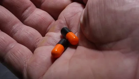 Hands of a  man holding pills,  concept Medicine and Health. Vídeo Stock 149031858