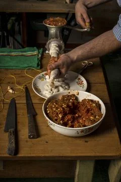 Hands of man making salame Foto stock