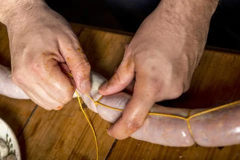 Hands of man making salame Stock Photos