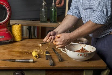 Hands of man making salame Stock Photos