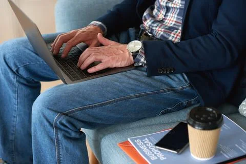 Hands, man or typing on laptop in office lounge for copywriting, editing Stock Photos
