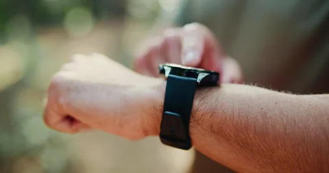 Hands, man outdoor or scroll with smart watch for fitness app, tracking heart Stock Footage 321061973