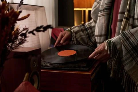 Hands of Man Placing Vinyl Record on Turntable Player at Home Stock Photos