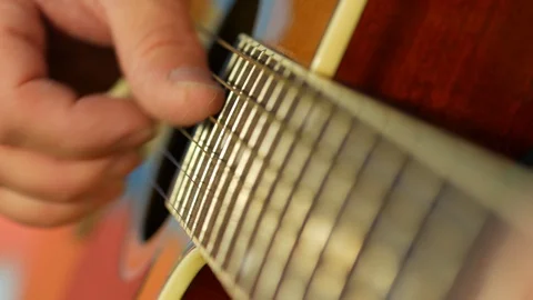Hands of man playing acoustic classic guitar. Self-isolation music classes Stock Footage 129821079
