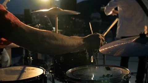 Hands of the man playing a drum set in dark colors Stock Footage 115938665
