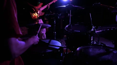 Hands of the man playing a drum set in dark colors Stock Footage 115938738
