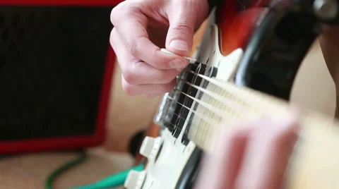 Hands of man playing electric guitar Stock Footage 59790350