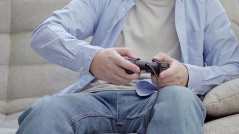 Hands of a man playing games with a joystick Stock Footage 160434976