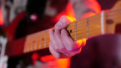 Hands of a man playing the guitar Stock Footage 233166660
