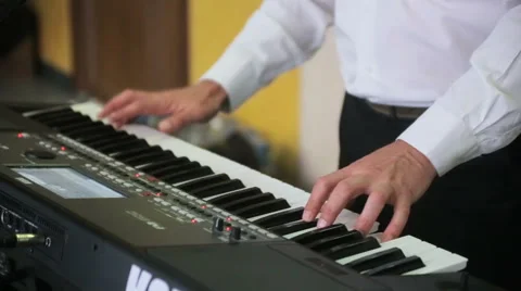 Hands of a man playing a synthesizer Stock Footage 62623754