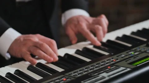 Hands of man, playing synthesizer Stock Footage 65254735