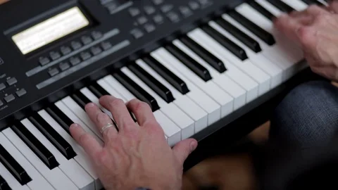Hands of a man playing a synthesizer. 库存影片 73350006