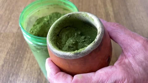 Hands of a man preparing yerba mate Stock Footage 303221699