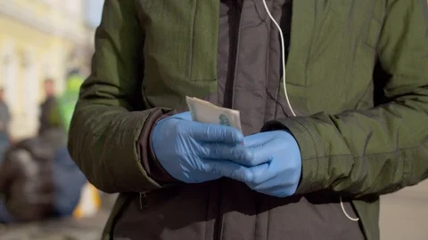 Hands of a man in protective gloves counting cash Stock Footage 126868099