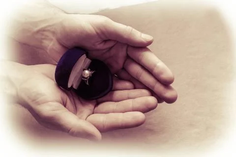 Hands of a man with a ring Stock Photos