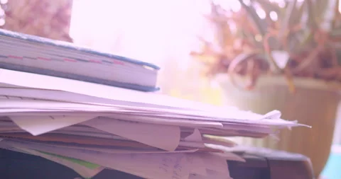 The hands of a man searching for a document in a stack of papers Stock Footage 334945809