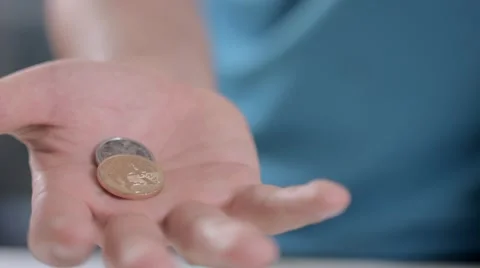 Hands of a man show to camera 1 real and 50 cents of a brazilian coin Видео 58509557