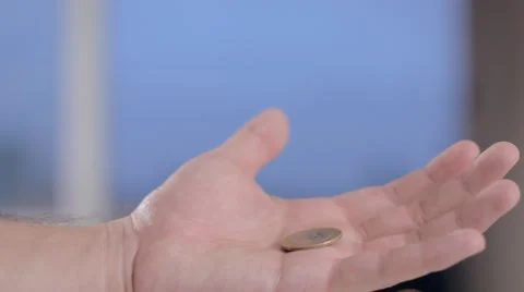Hands of a man show to camera 1 real brazilian coin Stock Footage 58509612