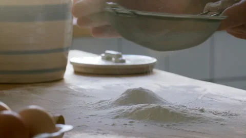 Hands of Man Sifting Flour on Kitchen Table before Baking Stock Footage 288806150