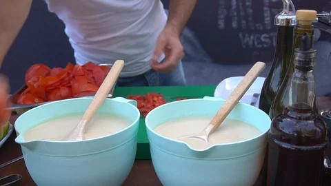 Hands Of A man Slice A Red Tomato Slices On A Wooden Board. Stockbeeldmateriaal 105832487