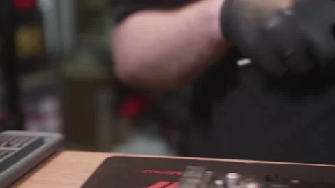 Hands of man taking bit for powered screwdriver from case to disassemble detail Stock Footage 154649341