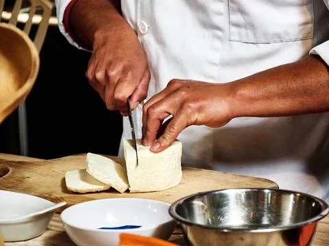 Hands of man taking a cut salad Stock Photos