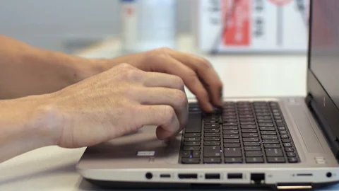 Hands of man typing on laptop computer at work home office. Modern pc notebook. Stock Footage 129920085