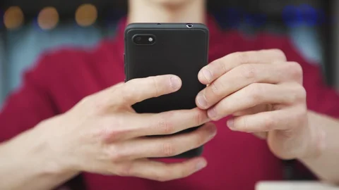 Hands of man typing sms on cell phone Video stock 111757462