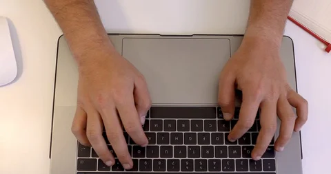 Hands of a man typing something on a keyboard Stock Footage 107768446